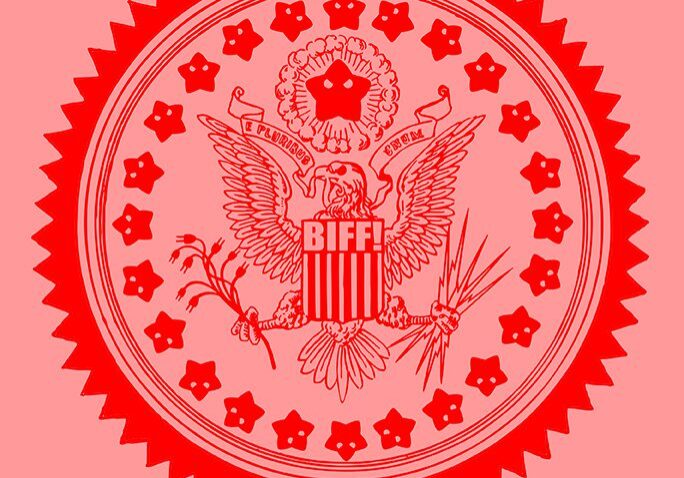 Red emblem with an eagle and star motifs in a circular design.